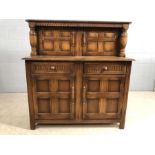 Dark wood buffet or sideboard with linen fold design and two cupboards over