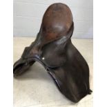 Brown leather horse riding saddle