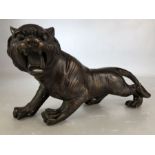 Bronzed figure of a roaring wild cat approx 30cm long