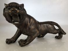 Bronzed figure of a roaring wild cat approx 30cm long