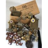 Collection of military pins, badges and buttons