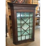 Wall hanging corner cupboard with glazed door