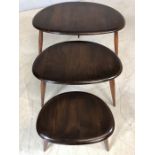 Ercol nest of three dark elm 'pebble' tables