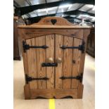 Small pine cupboard with heart detailing to upstand, approx 65cm x 35cm x 73cm tall
