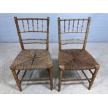 Pair of rush-seated chairs with bamboo style slatted backs and stretchers