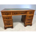 Modern twin pedestal desk with green and gold leather inlay and keys