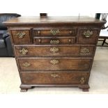 Oak chest of drawers with brass handle detailing (A/F), approx 97cm x 54cm x 94cm tall
