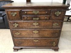 Oak chest of drawers with brass handle detailing (A/F), approx 97cm x 54cm x 94cm tall