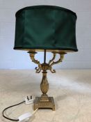 Brass table lamp with four branches and green shade, overall height approx 55cm