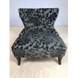 Contemporary low upholstered occasional chair