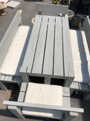 Large contemporary wooden garden table with four bench seats in grey painted finish, benches with