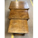Oak nest of three tables with turned legs, the largest with single drop leaf