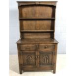 Dark wood dresser with linen fold design, approx 92cm x 42cm x 166cm tall
