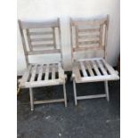 Pair of aged teak folding chairs