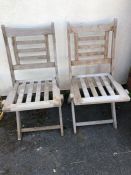 Pair of aged teak folding chairs