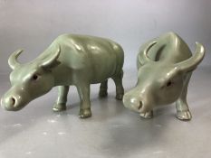 Pair of celadon green glazed water buffalo, each approx 16cm x 8cm