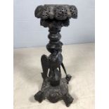 Heavily carved Eastern origin plant stand / candleholder with carved detailing of a bird fighting