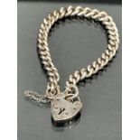Hallmarked silver bracelet (each link stamped) with heart shaped lock (marked stirling silver)