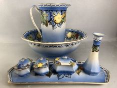 Dressing table set comprising jug, bowl, tray, pots, vase etc with colourful fruit design (A/F)