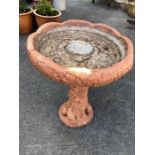 Concrete bird bath with squirrels and birds to plinth, approx 65cm tall x 49cm in diameter