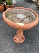 Concrete bird bath with squirrels and birds to plinth, approx 65cm tall x 49cm in diameter