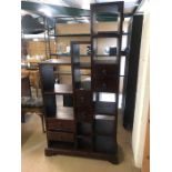 Modern dark wood shelving unit with six integral drawers, approx 90cm x 35cm x 182cm tall