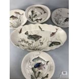 Johnson Bros Fish pattern ceramics to include large platter, six plates and lidded serving dish.
