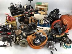 Collection of various boxed and unboxed fly fishing and course fishing reels