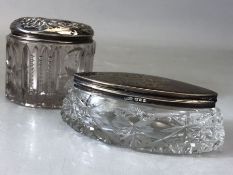 Two Glass and hallmarked silver lidded dressing table pots