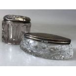 Two Glass and hallmarked silver lidded dressing table pots