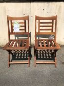 Pair of teak folding chairs