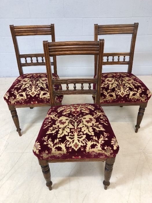 Three velvet upholstered chairs