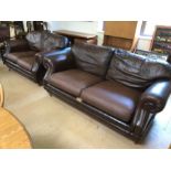 Three seater and two seater brown leather sofas on castors by Thomas Lloyd, the larger approx