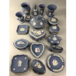 Collection of Wedgwood blue ground jasperware decorative items to include pin dishes, vases, a bell,