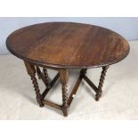 Oak drop leaf table on turned legs