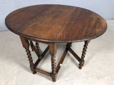 Oak drop leaf table on turned legs