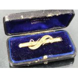 15ct Gold Bar Brooch with twisted foliate decoration and scrolls in box labelled Louis EBerlin