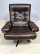 Dark brown leather Swedish swivel armchair by MOBEL