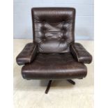 Dark brown leather Swedish swivel armchair by MOBEL
