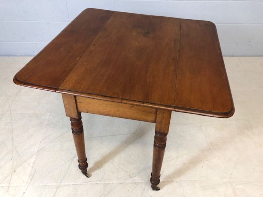 Mahogany drop leaf table on turned legs with original castors and hidden drawer, approx 90cm x - Image 2 of 10