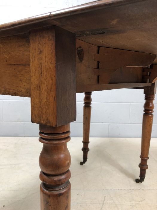 Mahogany drop leaf table on turned legs with original castors and hidden drawer, approx 90cm x - Image 10 of 10