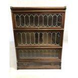 Four section early Globe Wernicke cabinet / book shelves with brass fitments, leaded glass and