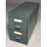 Small grey metal desktop filing cabinet of two drawers, approx 51cm x 21cm x 34cm