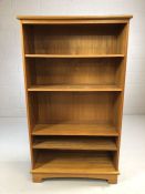 Teak style book case with three adjustable shelves, approx 80cm x 32cm x 140cm