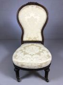 Low Victorian wooden framed nursing chair, newly upholstered in cream fabric