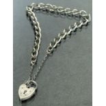 Silver hallmarked bracelet with hallmarked silver heart shaped padlock, each link marked with safety