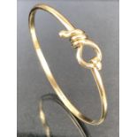 9ct Gold bangle in presentation box approx 14.2g