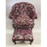 Contemporary upholstered low bedroom chair on front castors with matching foot stool