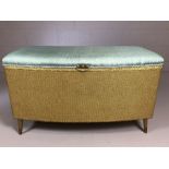 Gold Lloyd loom style ottoman on tapering legs with blue upholstered seat