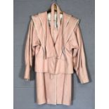 Leather two piece 1980s vintage skirt suit in soft pink with white piping, approx size 12